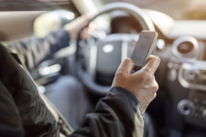 Person driving and making a phone call